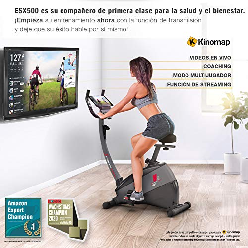 Sportstech ESX500 Bicicleta estática - Marca de Calidad Alemana - Vídeos en Directo y App multijugador + Pantalla de 5,5", Masa de Volante de 12KG, Compatible con pulsómetro - Correa silenciosa