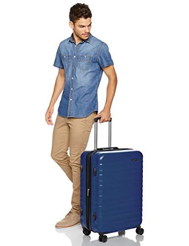 Amazon Basics - Maleta de viaje rígidaa giratoria - 68 cm, Azul marino