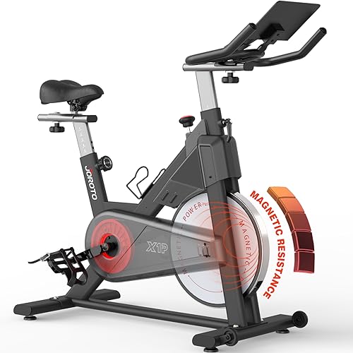 JOROTO Bicicleta Estática Magnética, bici estatica para en Casa con transmisión por correa, manillar ajustable en 4 direcciones, monitor LCD, soporte para tableta extra grande, capacidad de 150 kg.