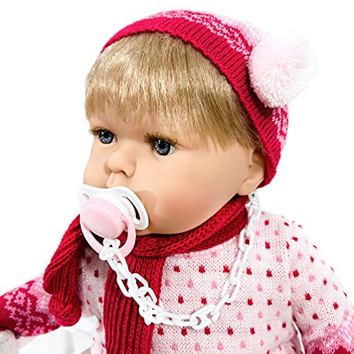 Muñeca Tita Tricot para que los niños aprendan a poner y quitarle la ropa, muy blandita y con un suave perfume a vainilla. Conjunto de punto con zapatos de charol. Muñeca preciosa